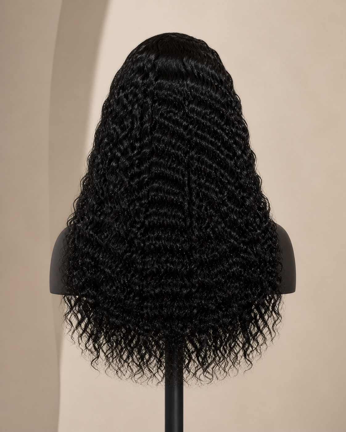 Back view of a long natural-black deep-wave glueless human hair wig direction