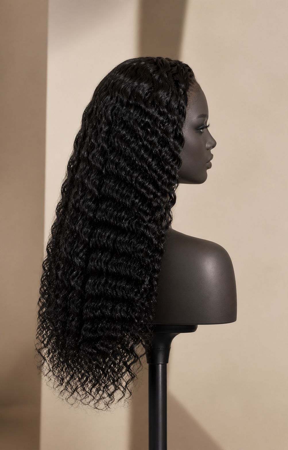 Side profile of a long natural-black deep-wave glueless human hair wig direction