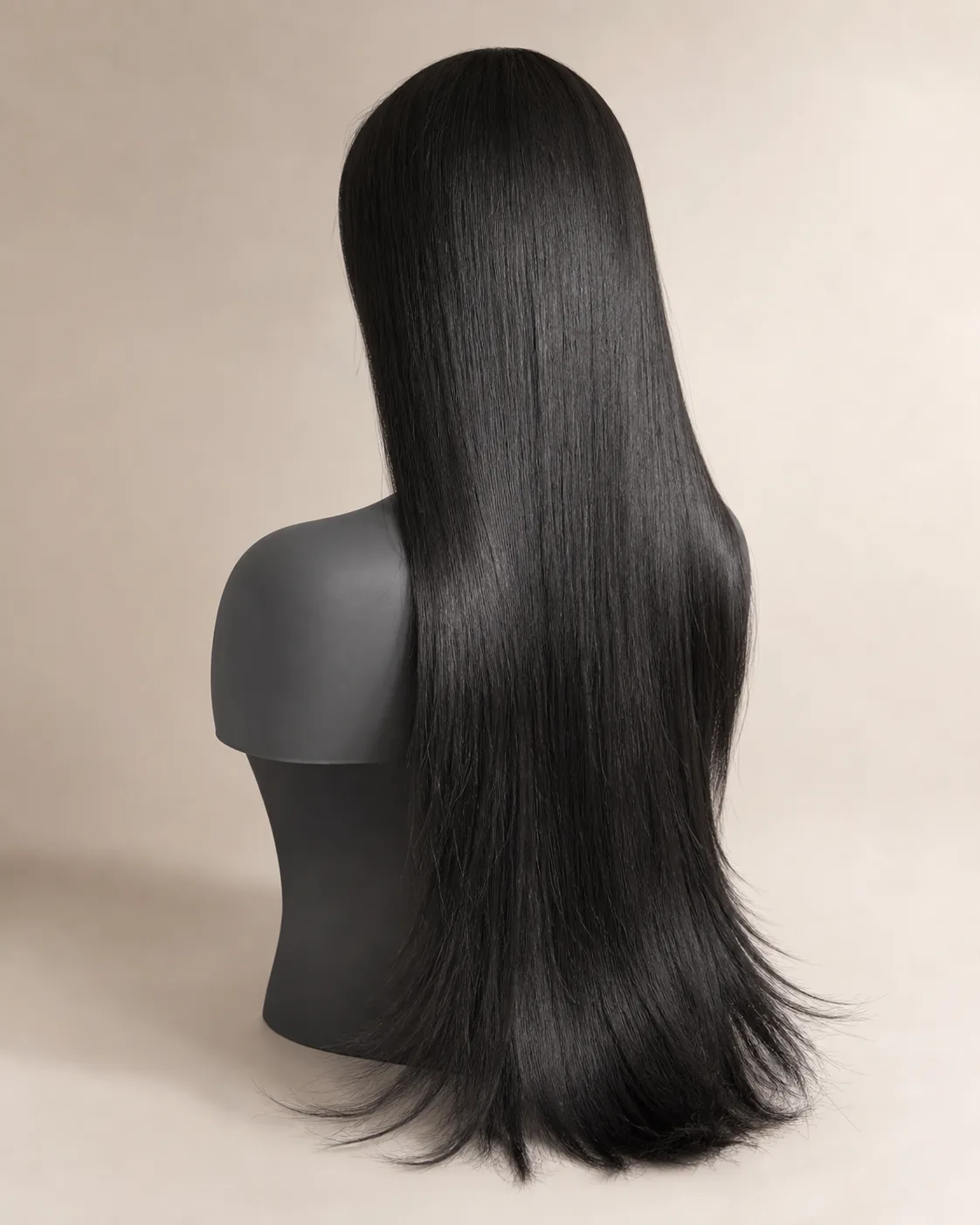 Long straight human hair wig on a black mannequin head
